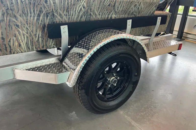 Slide: The Image of Trailer wheel of 2026 Tracker Grizzly 1650 T Prairie Wings Edition with camouflage design. - 8