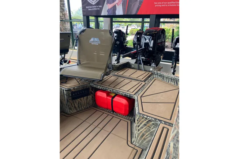 Slide: The Image of 2026 Tracker Grizzly 1650 T Prairie Wings Edition boat interior with seating and storage compartments. - 4