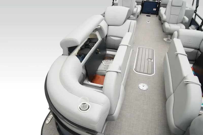 Slide: The Image of Luxurious interior of 2026 Regency 230 DL pontoon boat with plush seating and storage. - 13