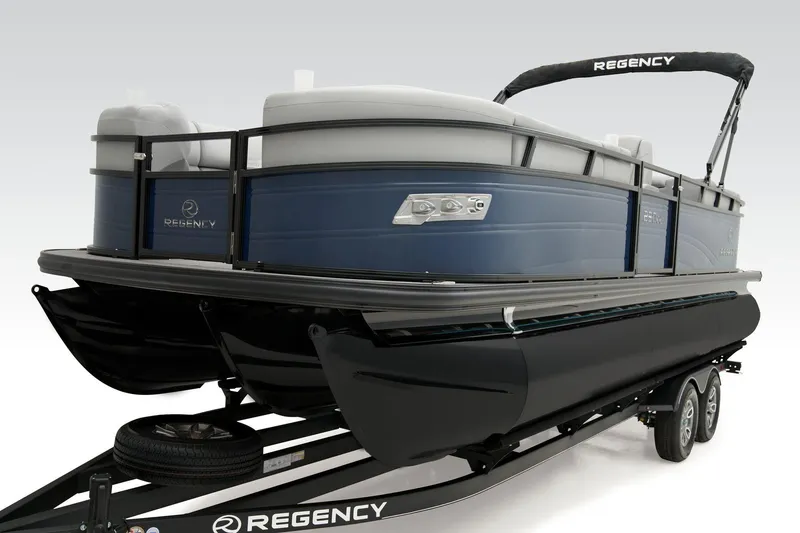 Slide: The Image of 2026 Regency 230 DL pontoon boat on trailer, featuring sleek design and modern amenities. - 16