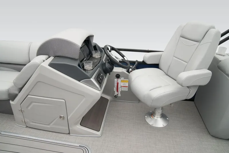 Slide: The Image of 2026 Regency 230 DL boat interior with captain's chair and control console. - 3