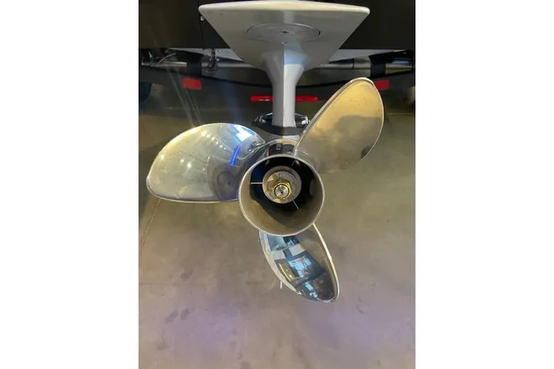 Slide: The Image of 2026 Tracker Pro Team 195 boat propeller, shiny metal blades, close-up view. - 5