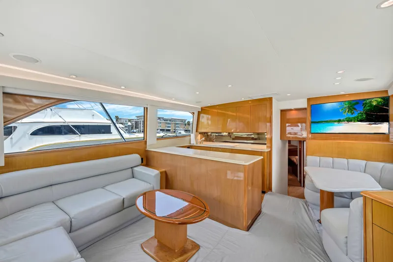 Slide: The Image of Luxurious interior of a 2001 Viking 55 Convertible yacht with modern furnishings. - 14
