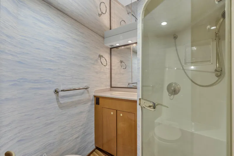 Slide: The Image of Bathroom interior of 2001 Viking 55 Convertible yacht with shower and vanity. - 29
