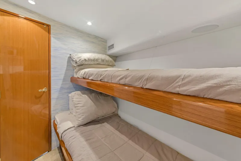 Slide: The Image of Bunk beds in the cabin of a 2001 Viking 55 Convertible yacht. - 31