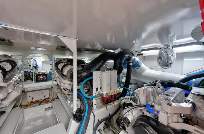 Slide: The Image of Engine room of a 2001 Viking 55 Convertible yacht with visible machinery and components. - 34