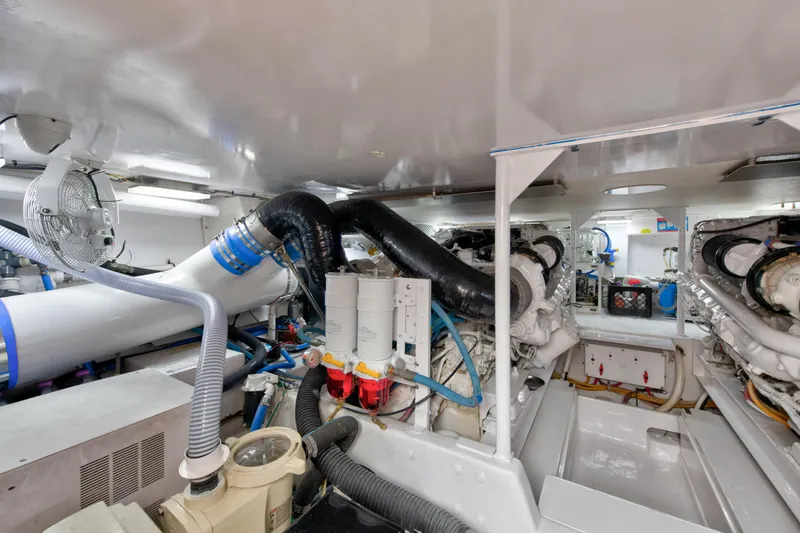Slide: The Image of Engine room of a 2001 Viking 55 Convertible yacht with visible machinery and components. - 35