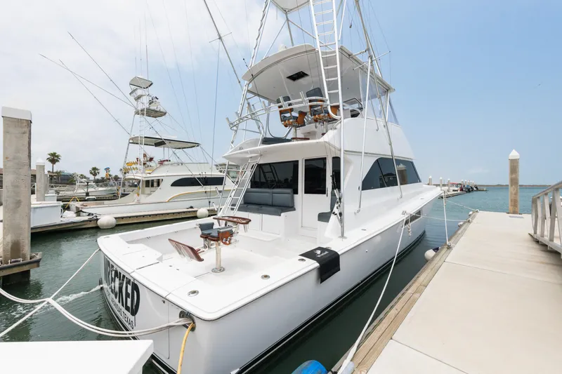 Slide: The Image of 2001 Viking 55 Convertible yacht docked at marina. - 4