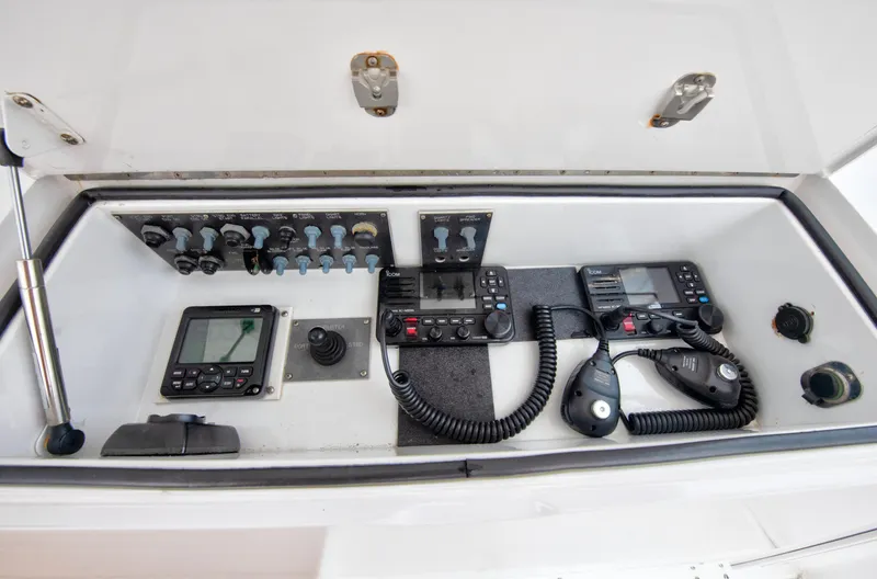 Slide: The Image of 2001 Viking 55 Convertible boat control panel with navigation and communication equipment. - 8