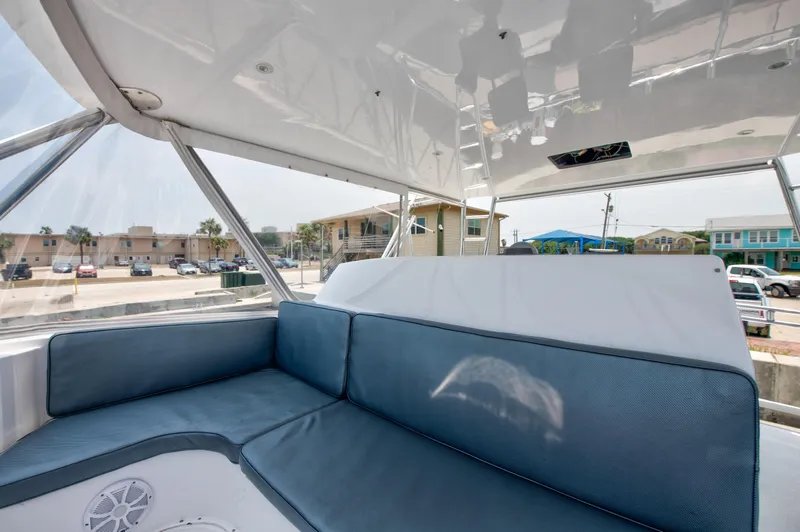 Slide: The Image of Interior seating area of 2001 Viking 55 Convertible yacht with blue cushions. - 9