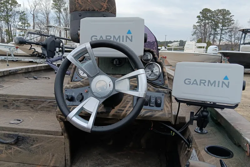 Slide: The Image of 2018 G3 Sportsman 17 Camo boat dashboard with Garmin navigation systems. - 12