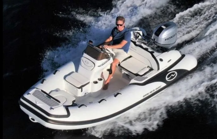 The Image of Manufacturer Provided Image: 2025 Walker Bay Venture 13 boat cruising on water with driver. - 0