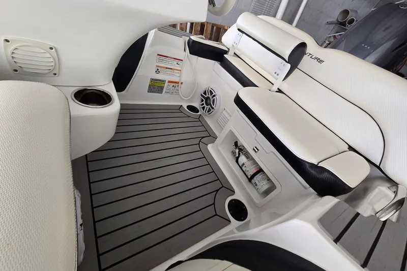 Slide: The Image of Interior of 2025 Walker Bay Venture 13 boat with seating and safety equipment. - 4