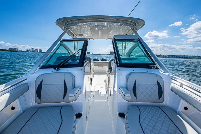 Slide: The Image of 2022 Pursuit DC 266 Dual Console boat interior with ocean view. - 14