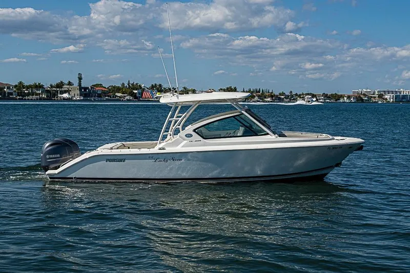 Slide: The Image of 2022 Pursuit DC 266 Dual Console boat cruising on a sunny day. - 31