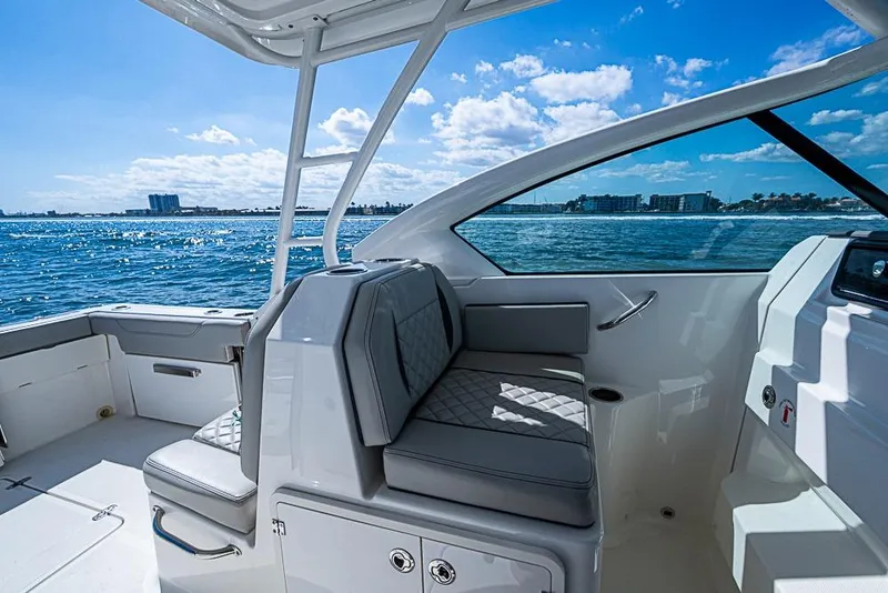 Slide: The Image of 2022 Pursuit DC 266 Dual Console boat interior with ocean view. - 34