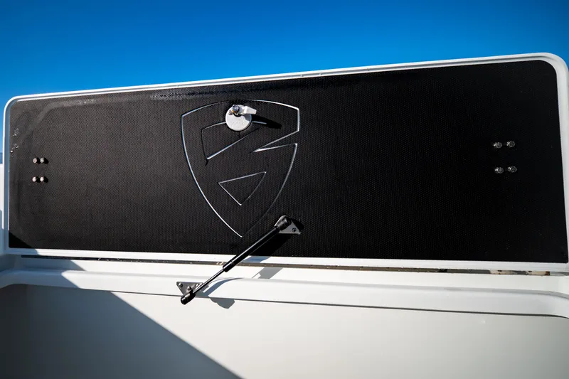 Slide: The Image of 2016 Barker Boatworks 26 Calibogue Bay, black panel with logo, under clear blue sky. - 13