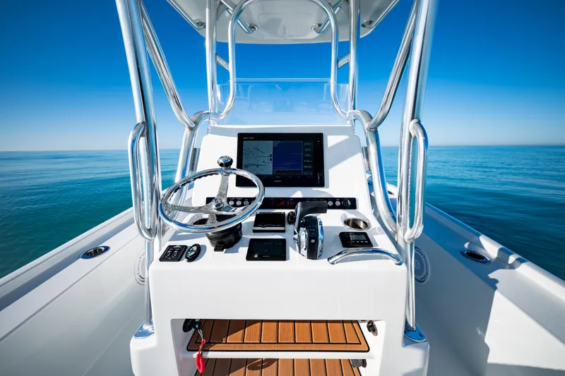 Slide: The Image of 2016 Barker Boatworks 26 Calibogue Bay helm with ocean view and navigation equipment. - 18