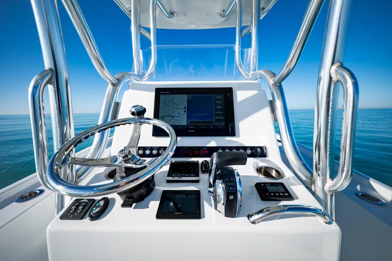 Slide: The Image of Barker Boatworks 26 Calibogue Bay 2016 helm with modern navigation equipment and ocean view. - 19