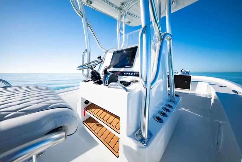Slide: The Image of 2016 Barker Boatworks 26 Calibogue Bay console with ocean view and clear blue sky. - 21