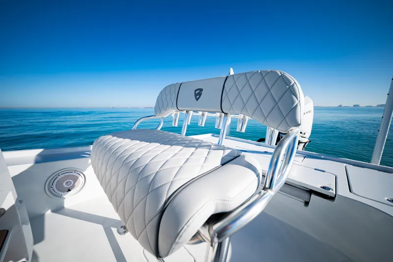 Slide: The Image of 2016 Barker Boatworks 26 Calibogue Bay with luxurious seating on calm blue waters. - 24