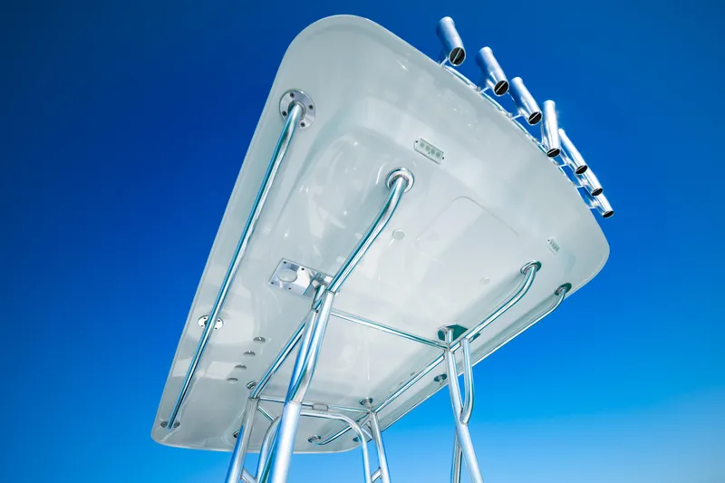 Slide: The Image of 2016 Barker Boatworks 26 Calibogue Bay T-top against clear blue sky. - 27