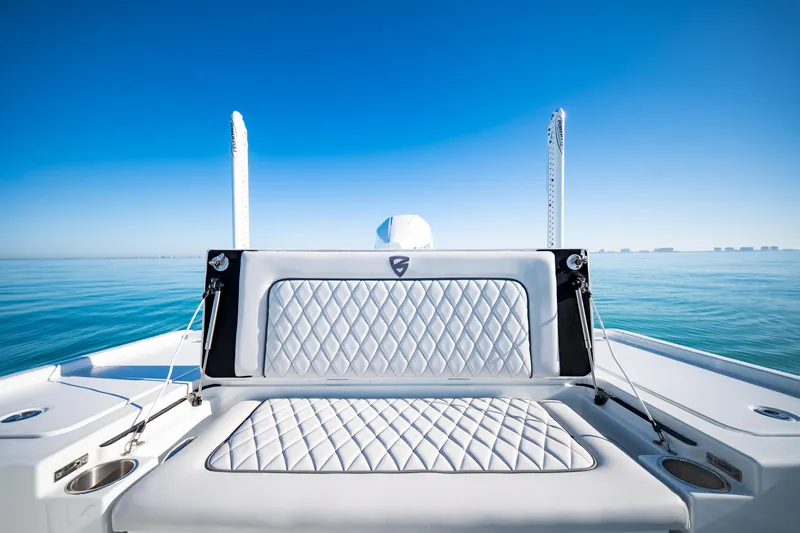 Slide: The Image of 2016 Barker Boatworks 26 Calibogue Bay, luxurious seating, calm ocean, clear blue sky. - 29