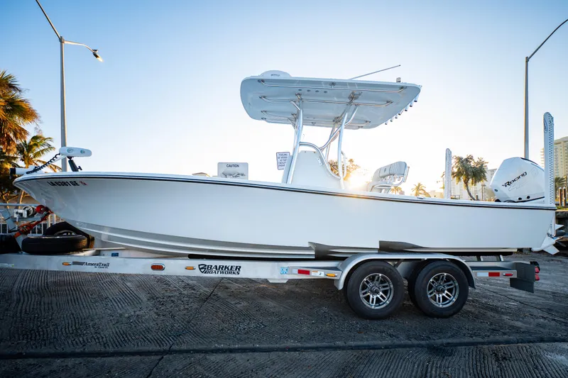 Slide: The Image of 2016 Barker Boatworks 26 Calibogue Bay on trailer at sunrise, side view. - 5