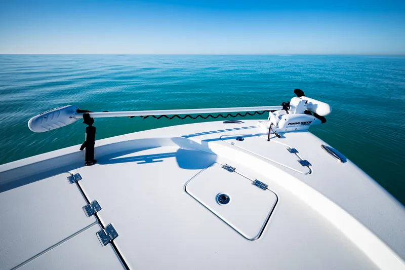 Slide: The Image of 2016 Barker Boatworks 26 Calibogue Bay on calm ocean waters, featuring a Minn Kota trolling motor. - 9