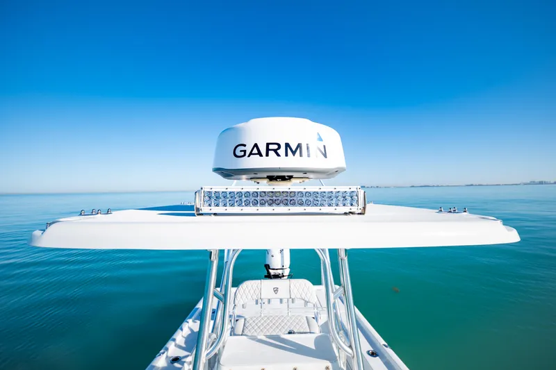 Slide: The Image of 2016 Barker Boatworks 26 Calibogue Bay with Garmin radar on calm blue water. - 25