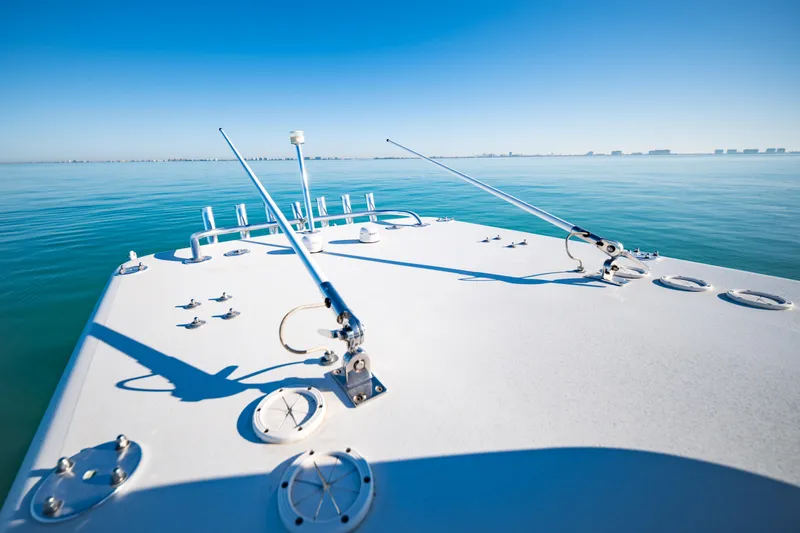 Slide: The Image of 2016 Barker Boatworks 26 Calibogue Bay on calm blue water, clear sky. - 26