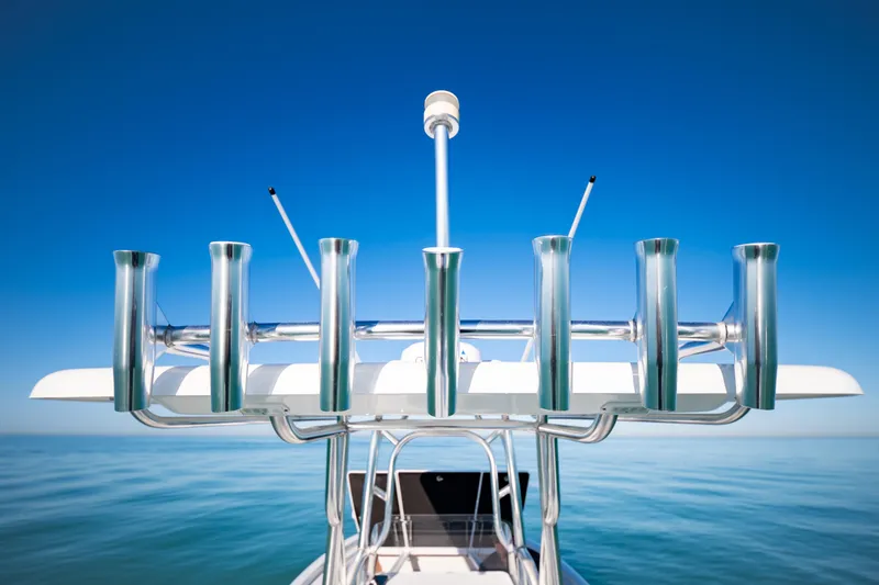 Slide: The Image of 2016 Barker Boatworks 26 Calibogue Bay, rod holders against clear blue sky. - 28