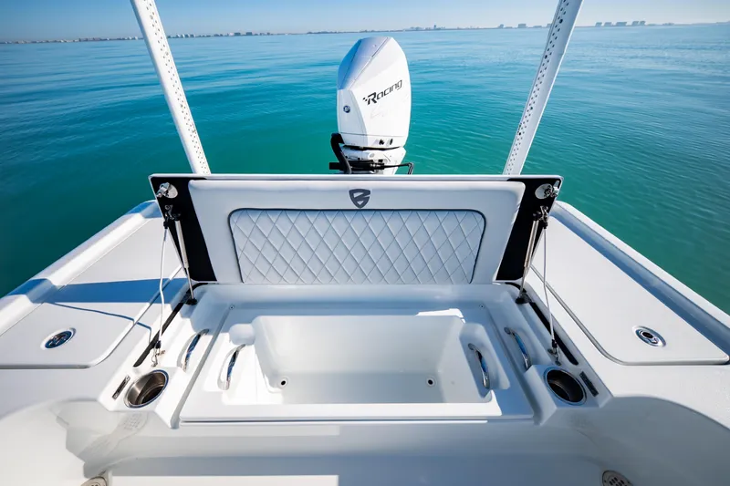 Slide: The Image of 2016 Barker Boatworks 26 Calibogue Bay, featuring sleek deck and powerful outboard motor. - 30