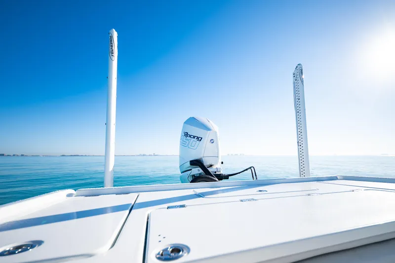 Slide: The Image of 2016 Barker Boatworks 26 Calibogue Bay on calm blue waters under clear sky. - 32