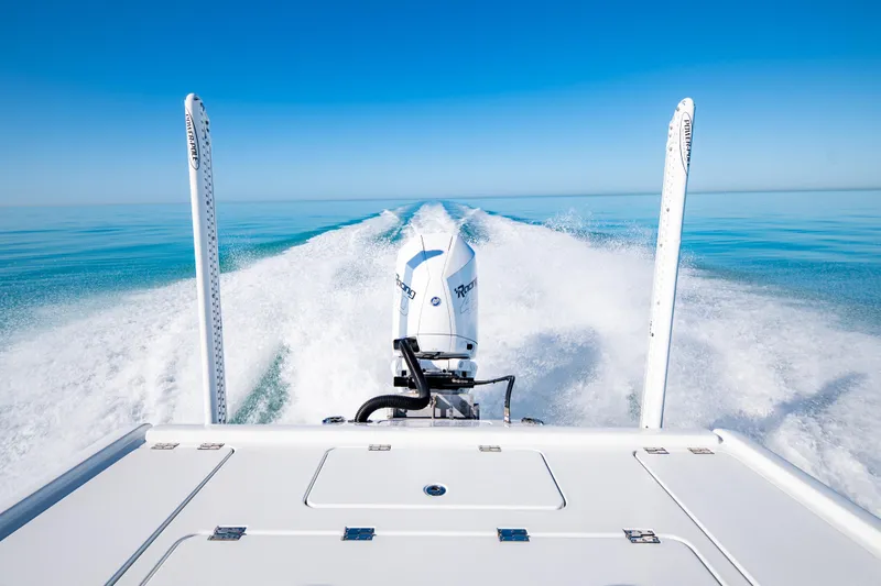 Slide: The Image of 2016 Barker Boatworks 26 Calibogue Bay cruising on clear blue water. - 34