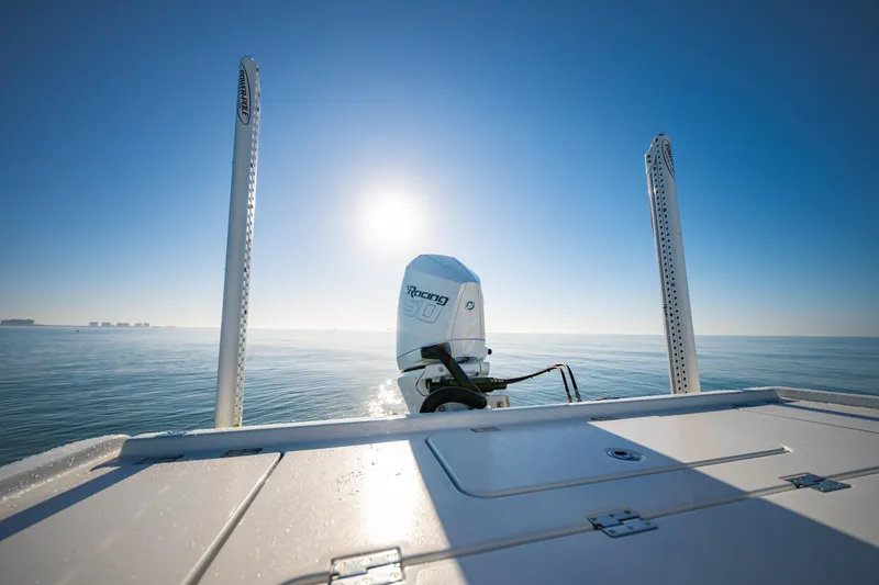 Slide: The Image of 2016 Barker Boatworks 26 Calibogue Bay on calm ocean under clear blue sky. - 35