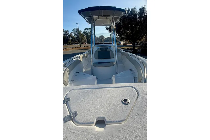 Slide: The Image of 2026 Key West 203 FS boat interior with seating and storage compartments. - 9