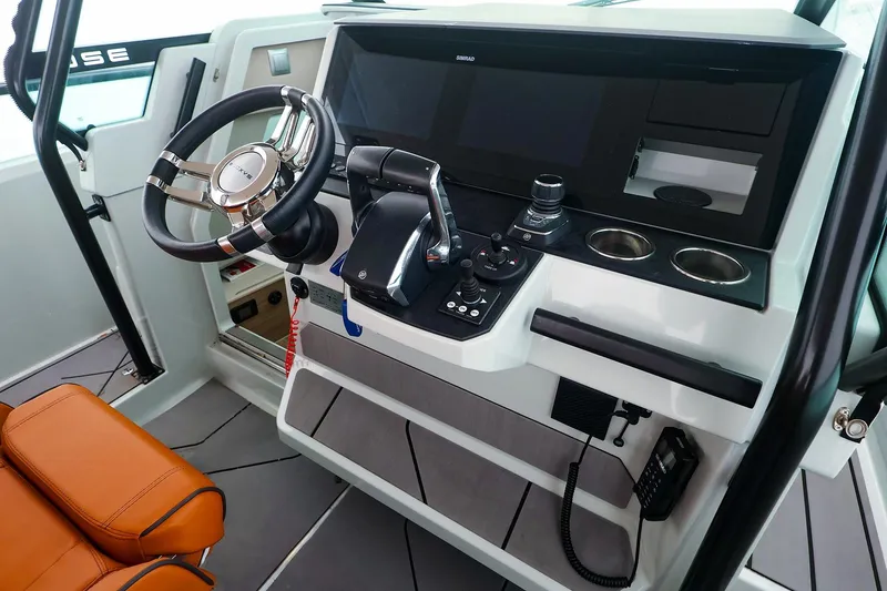 Slide: The Image of 2023 Saxdor 320 GTO helm with modern controls and leather seating. - 10