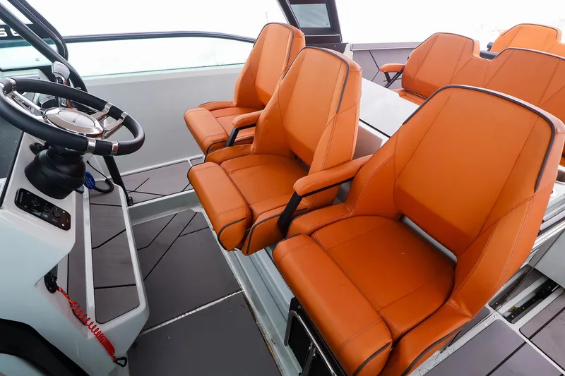Slide: The Image of 2023 Saxdor 320 GTO interior with orange seats and modern steering console. - 11