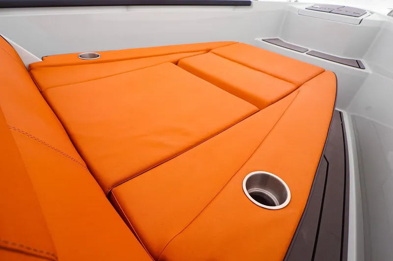 Slide: The Image of Orange seating on 2023 Saxdor 320 GTO boat with cup holders. - 16