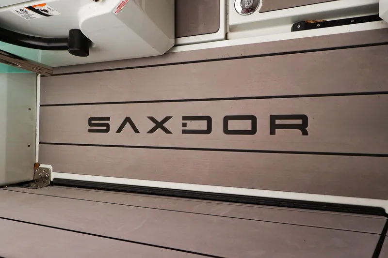 Slide: The Image of 2023 Saxdor 320 GTO boat deck with logo, featuring sleek design and modern aesthetics. - 26