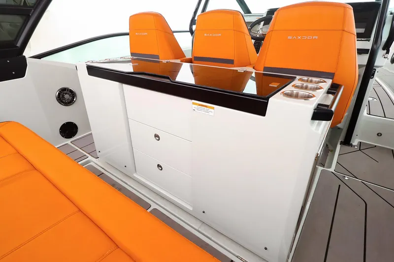 Slide: The Image of 2023 Saxdor 320 GTO interior with orange seats and modern console design. - 8
