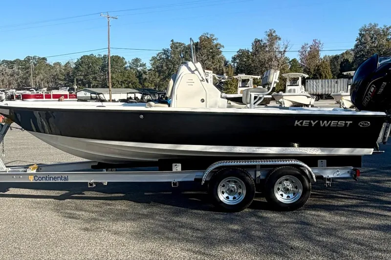The Image of 2026 Key West 210 Bay Reef boat on trailer, parked outdoors. - 0