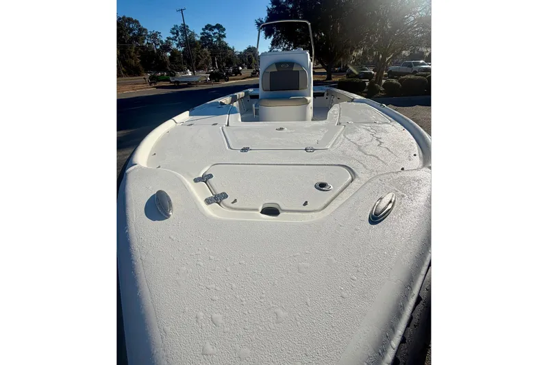 Slide: The Image of 2026 Key West 210 Bay Reef boat deck under sunlight, showcasing sleek design and spacious layout. - 13