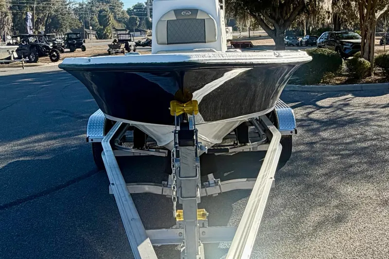 Slide: The Image of 2026 Key West 210 Bay Reef boat on trailer, parked outdoors. - 2