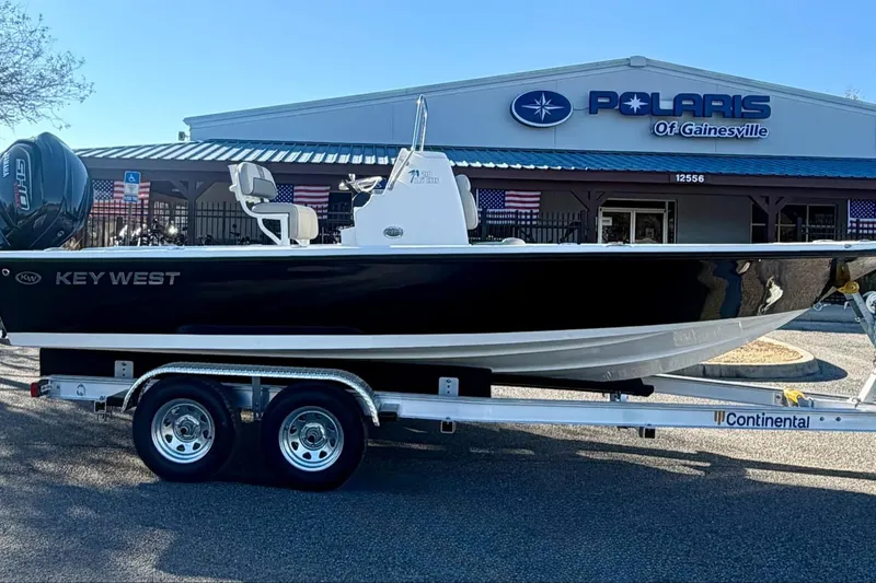 Slide: The Image of 2026 Key West 210 Bay Reef boat on trailer at Polaris dealership. - 4