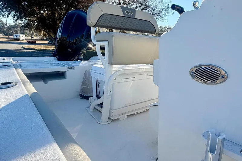 Slide: The Image of 2026 Key West 210 Bay Reef boat interior with seating and storage features. - 8