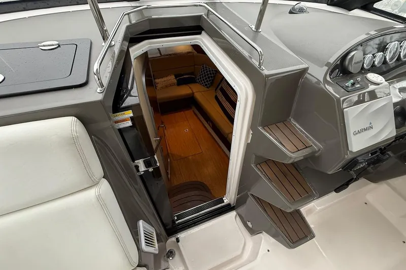 Slide: The Image of Interior view of 2012 Regal 35 Sport Coupe boat cabin with steps and seating area. - 13