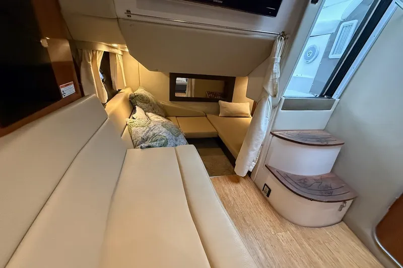 Slide: The Image of Interior of 2012 Regal 35 Sport Coupe with cozy seating and elegant design. - 22