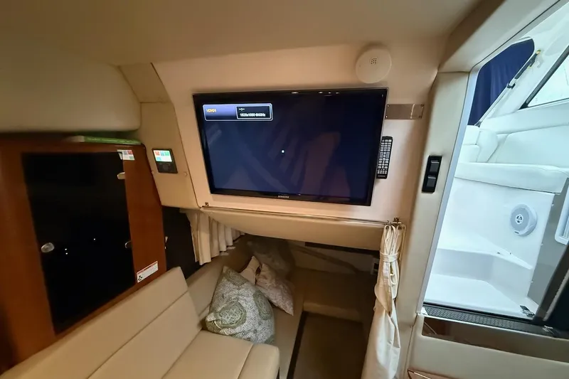 Slide: The Image of Interior of 2012 Regal 35 Sport Coupe with TV and seating area. - 23